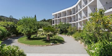 a building with trees and bushes