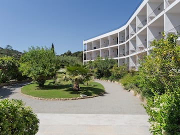 a building with trees and bushes