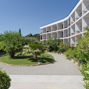 a building with trees and bushes