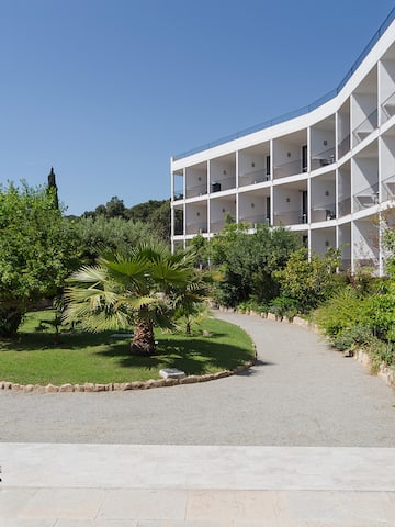 a building with trees and bushes