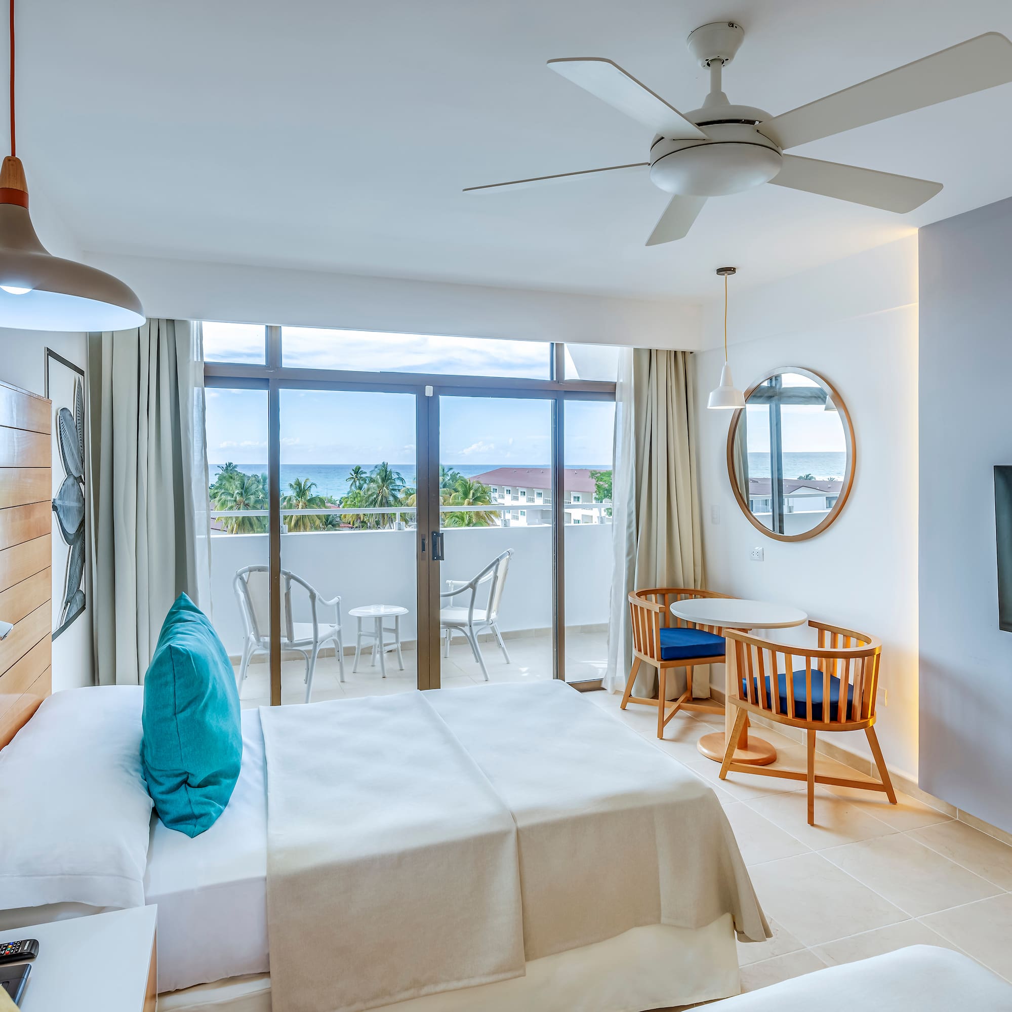 a room with a bed and a television