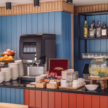 a coffee machine and a variety of dishes