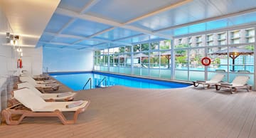 a pool with chairs and a deck chair