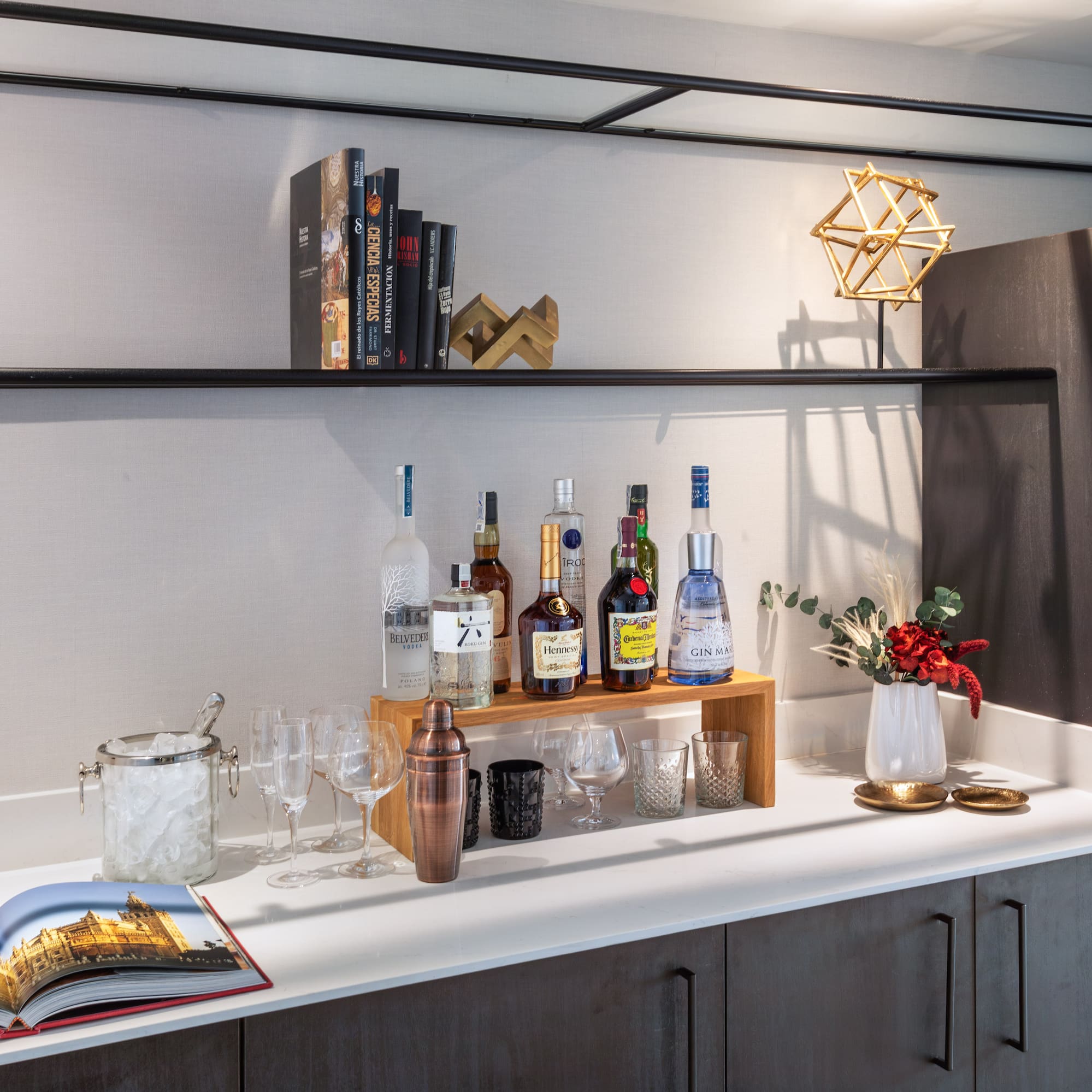 a bar with bottles and glasses on it