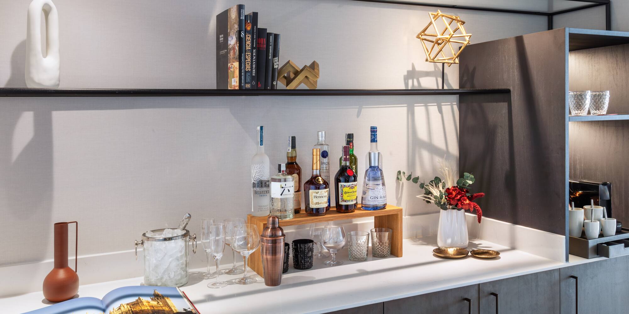 a bar with bottles and glasses on it