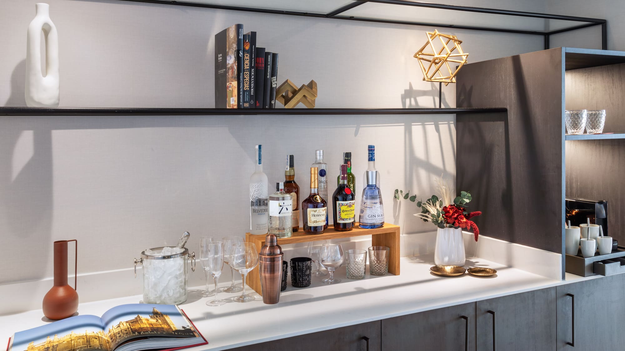 a bar with bottles and glasses on it