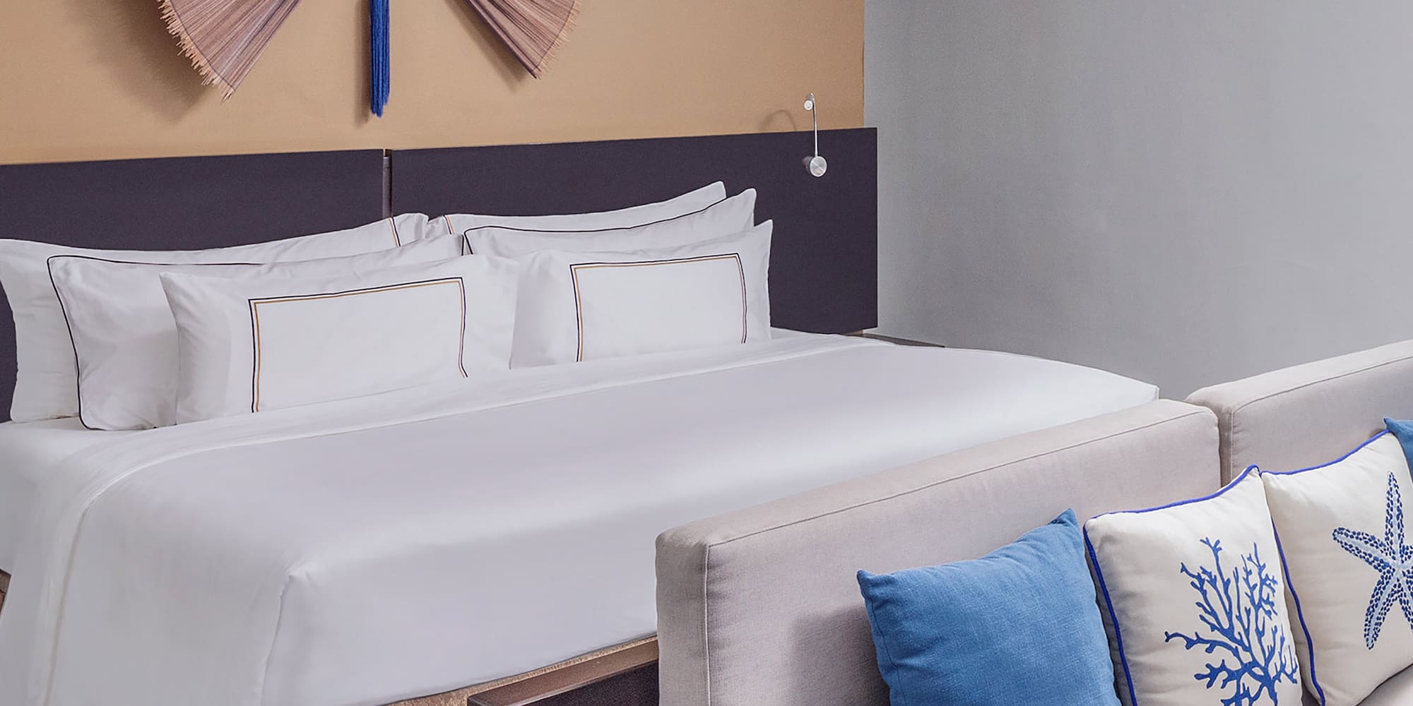 a bed with pillows in a room