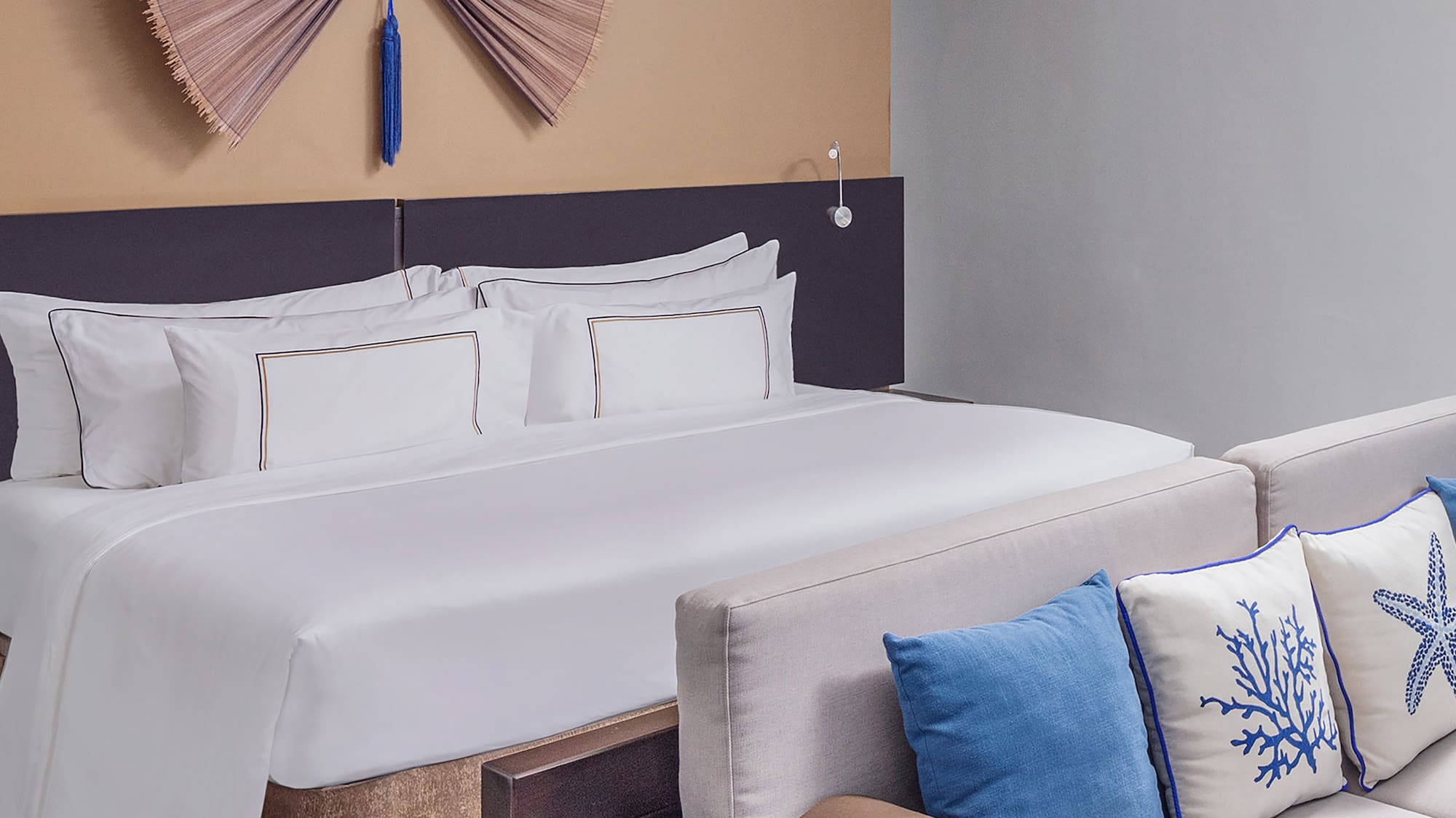 a bed with pillows in a room