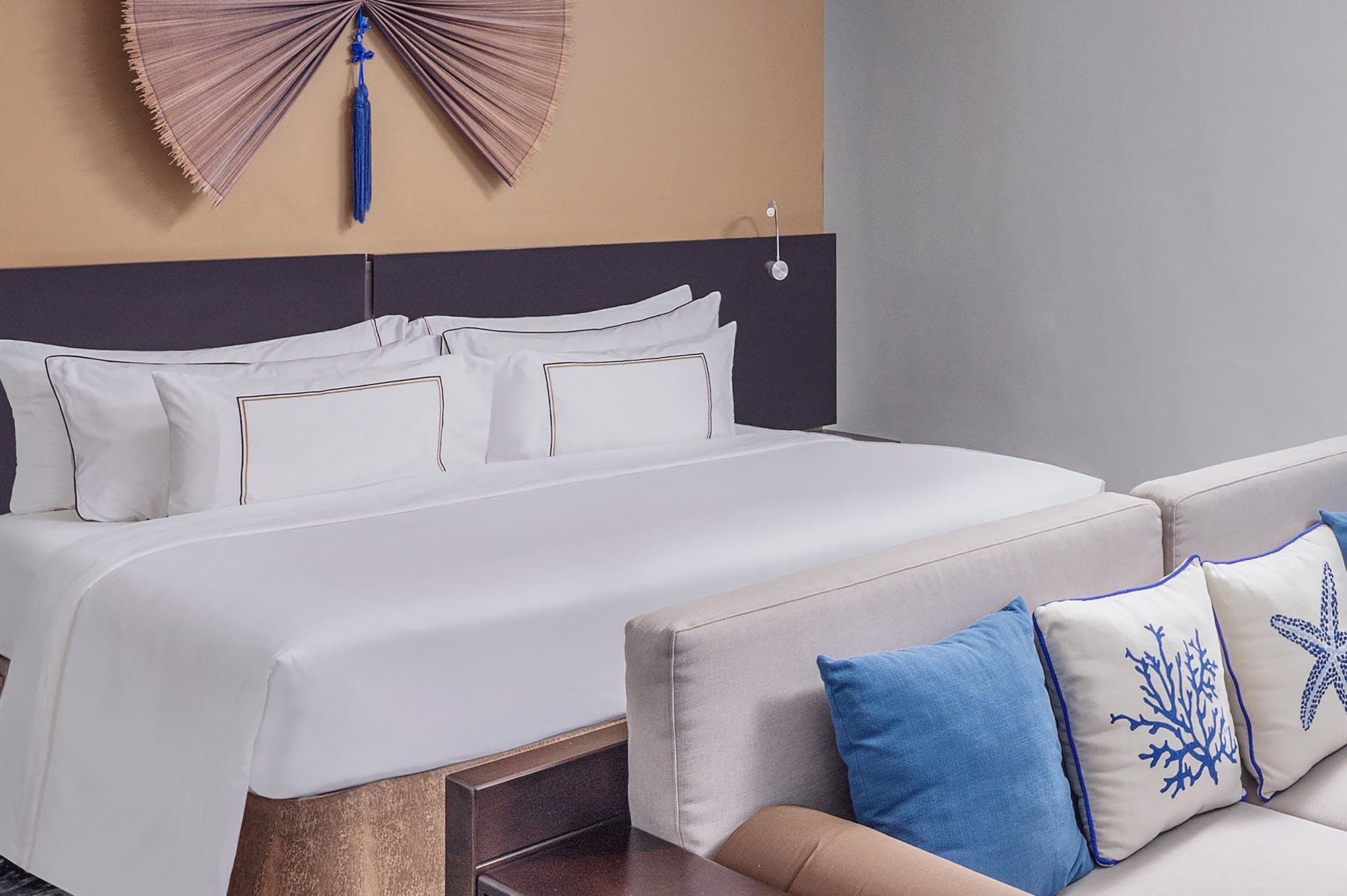 a bed with pillows in a room