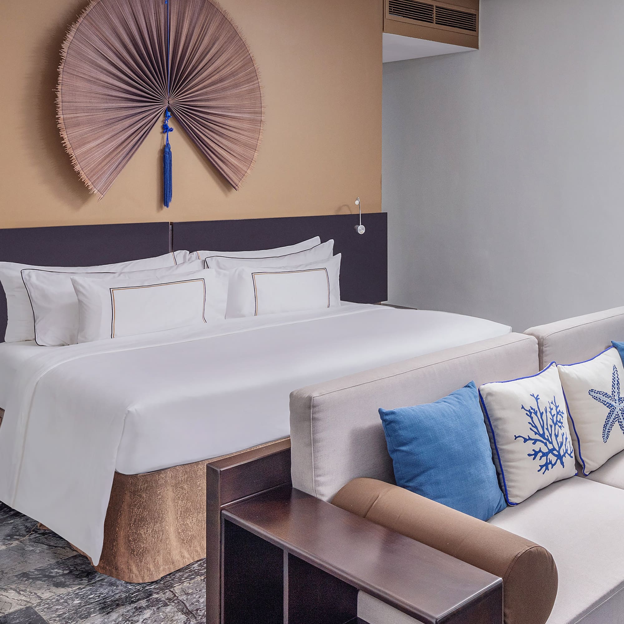 a bed with pillows in a room