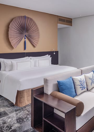 a bed with pillows in a room