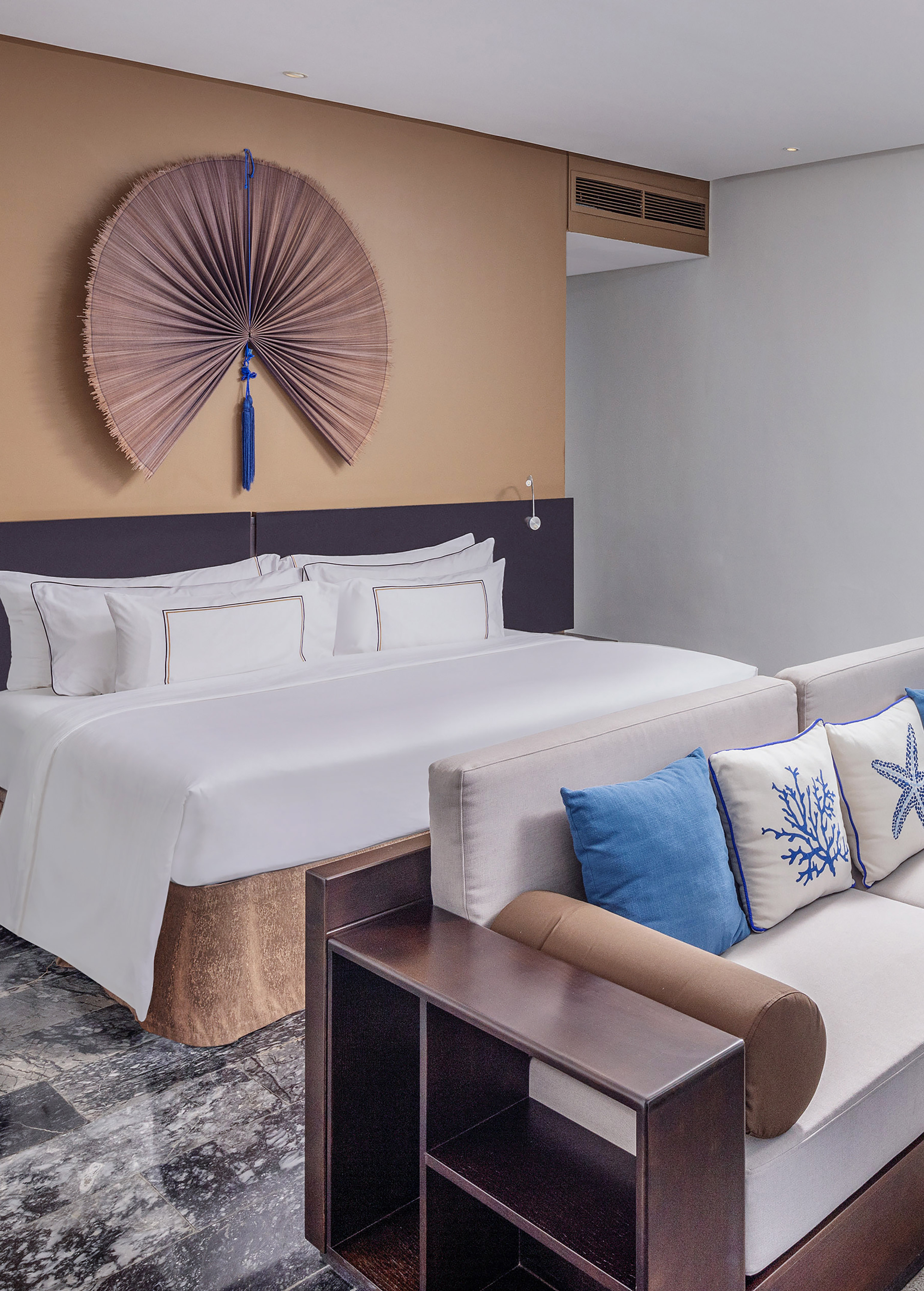 a bed with pillows in a room