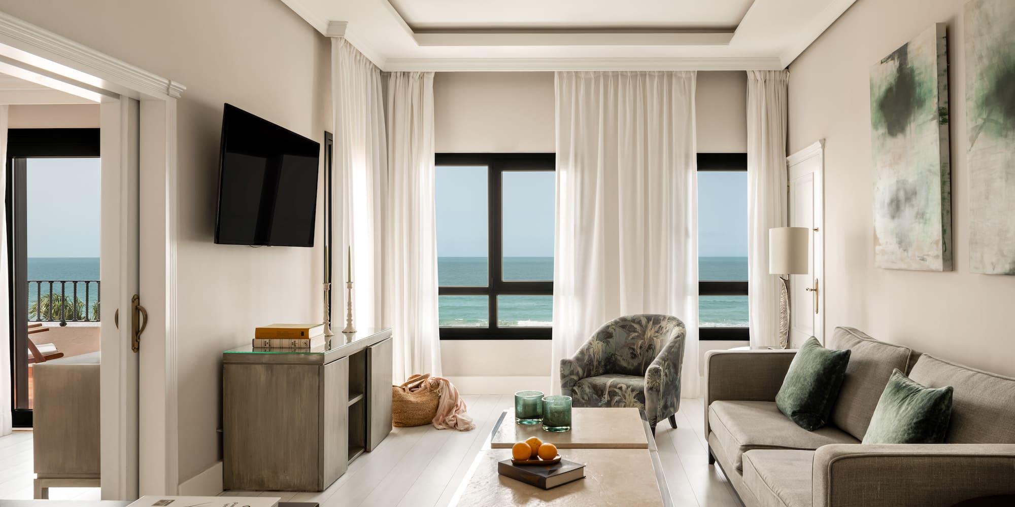 a living room with a television and a couch