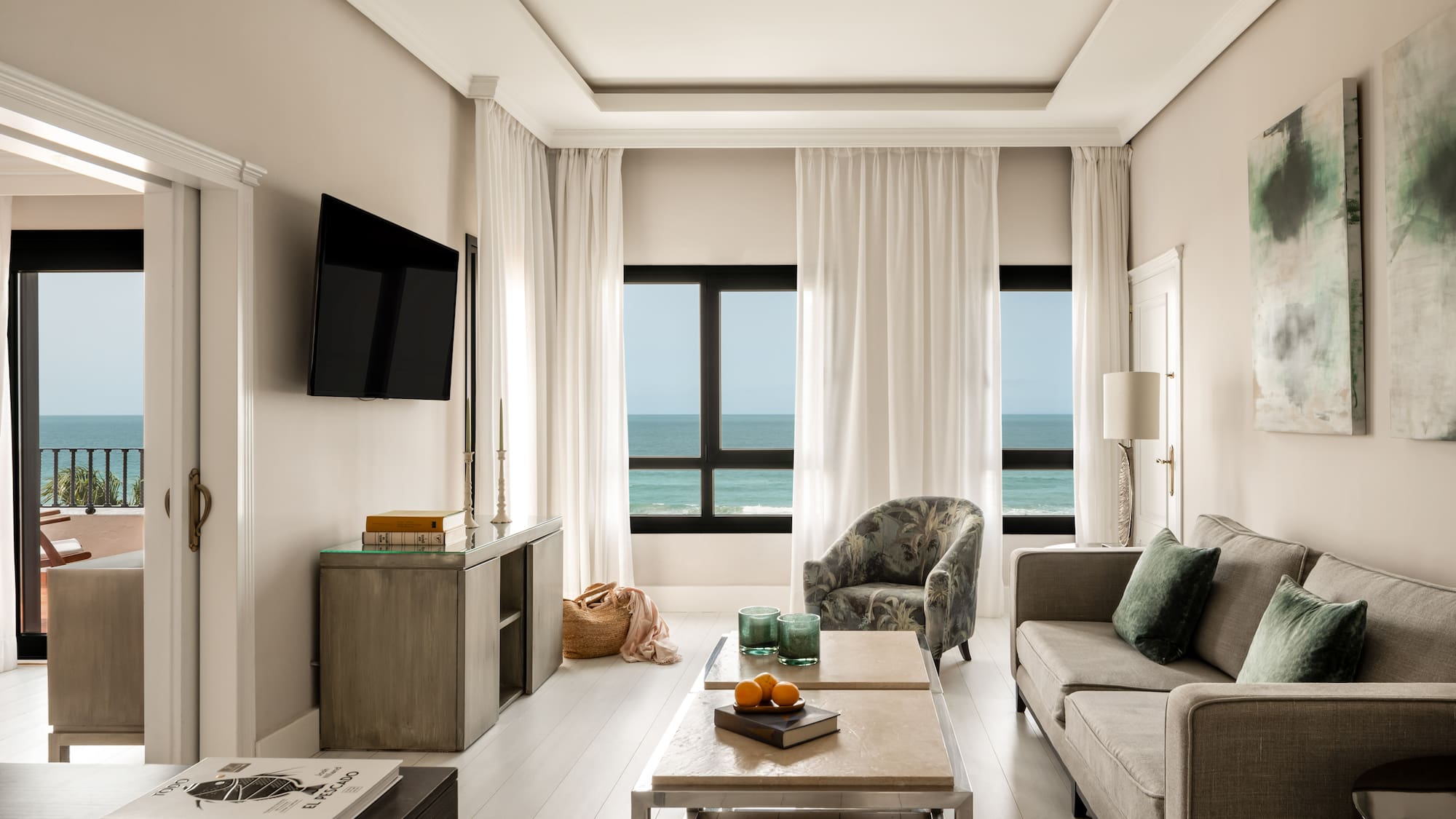 a living room with a television and a couch