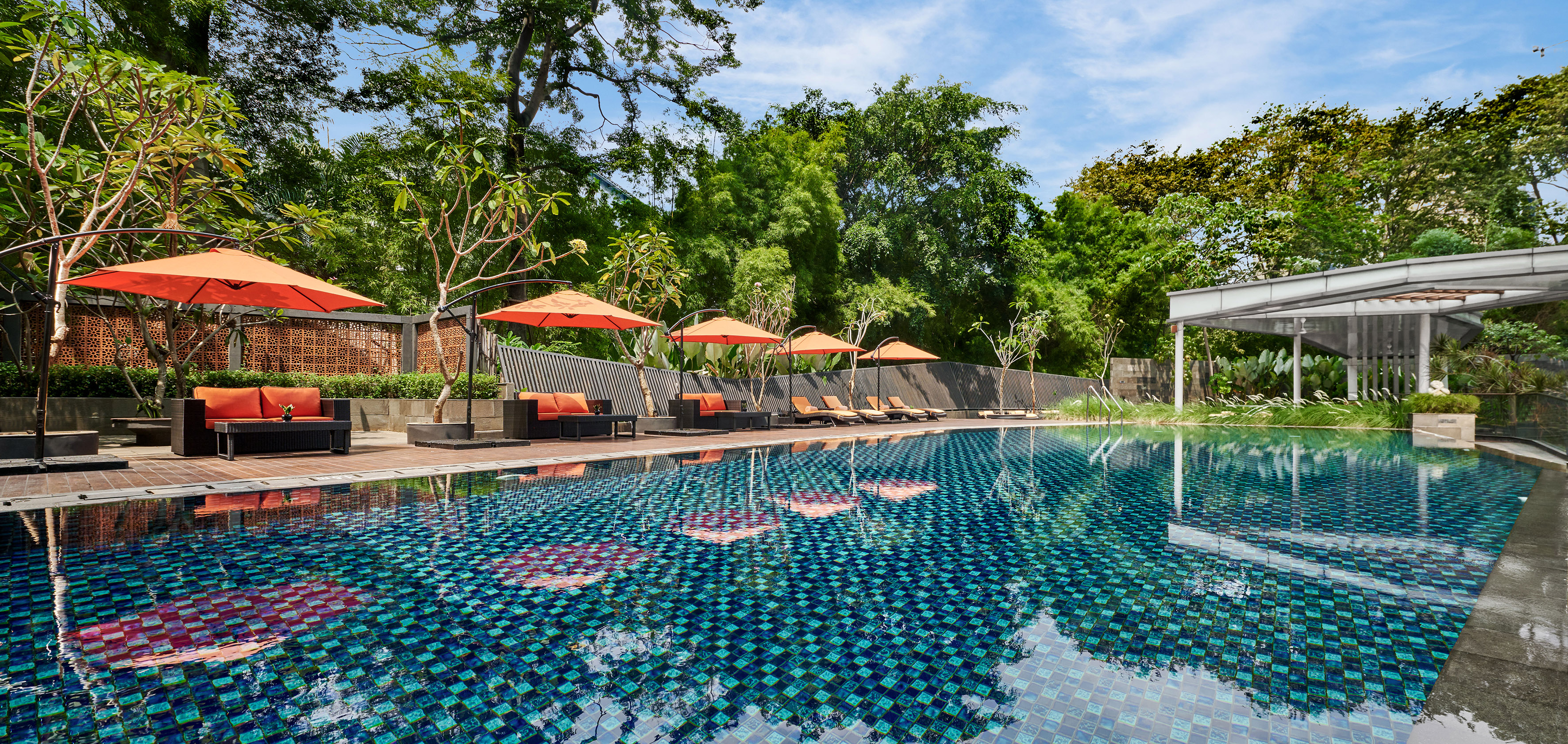 a pool with umbrellas and chairs