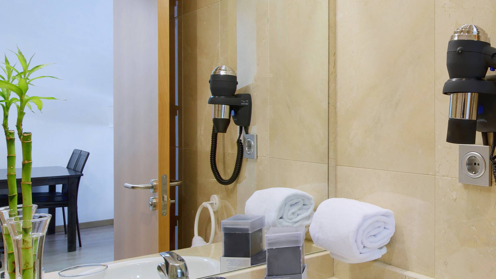 a bathroom with a mirror and sink