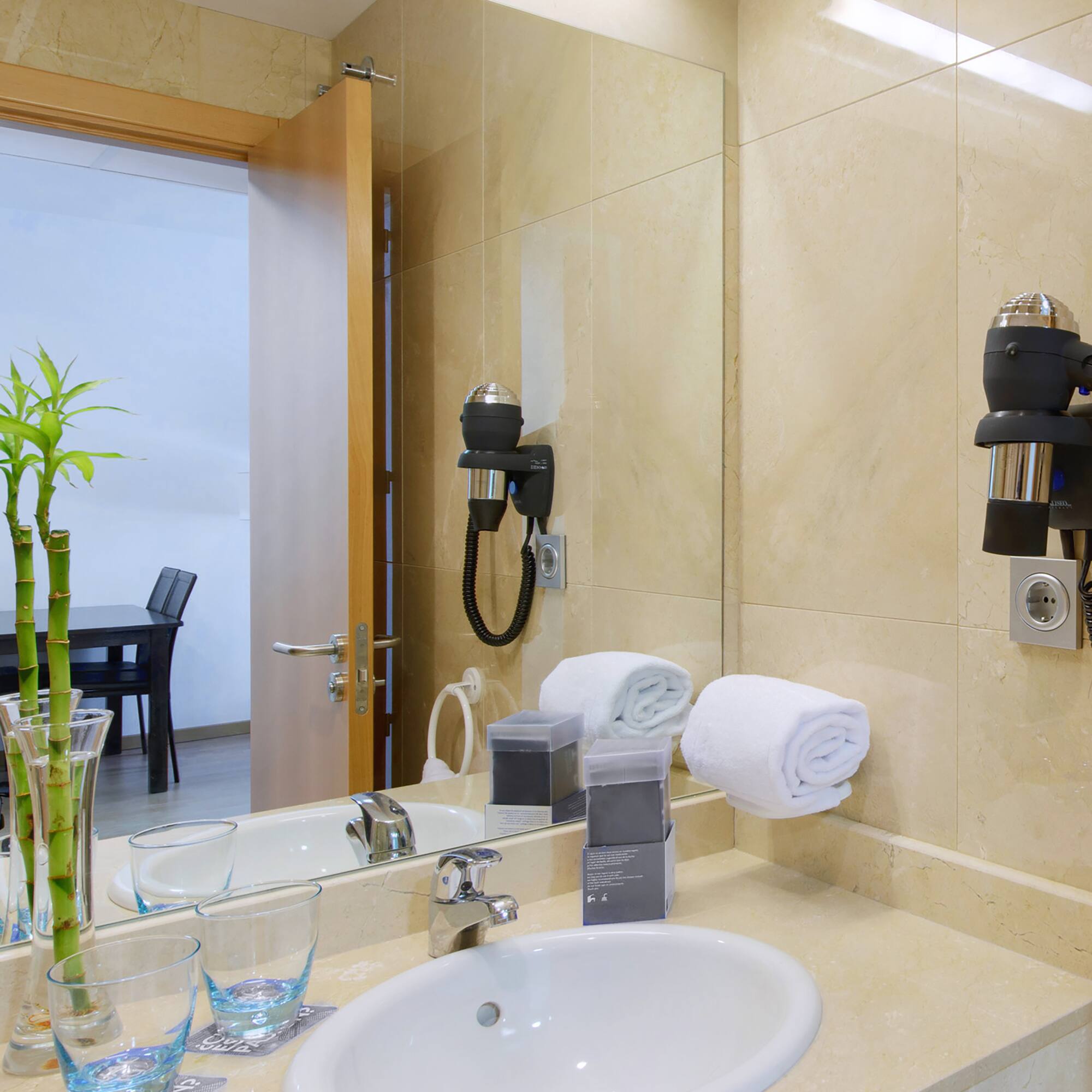 a bathroom with a mirror and sink