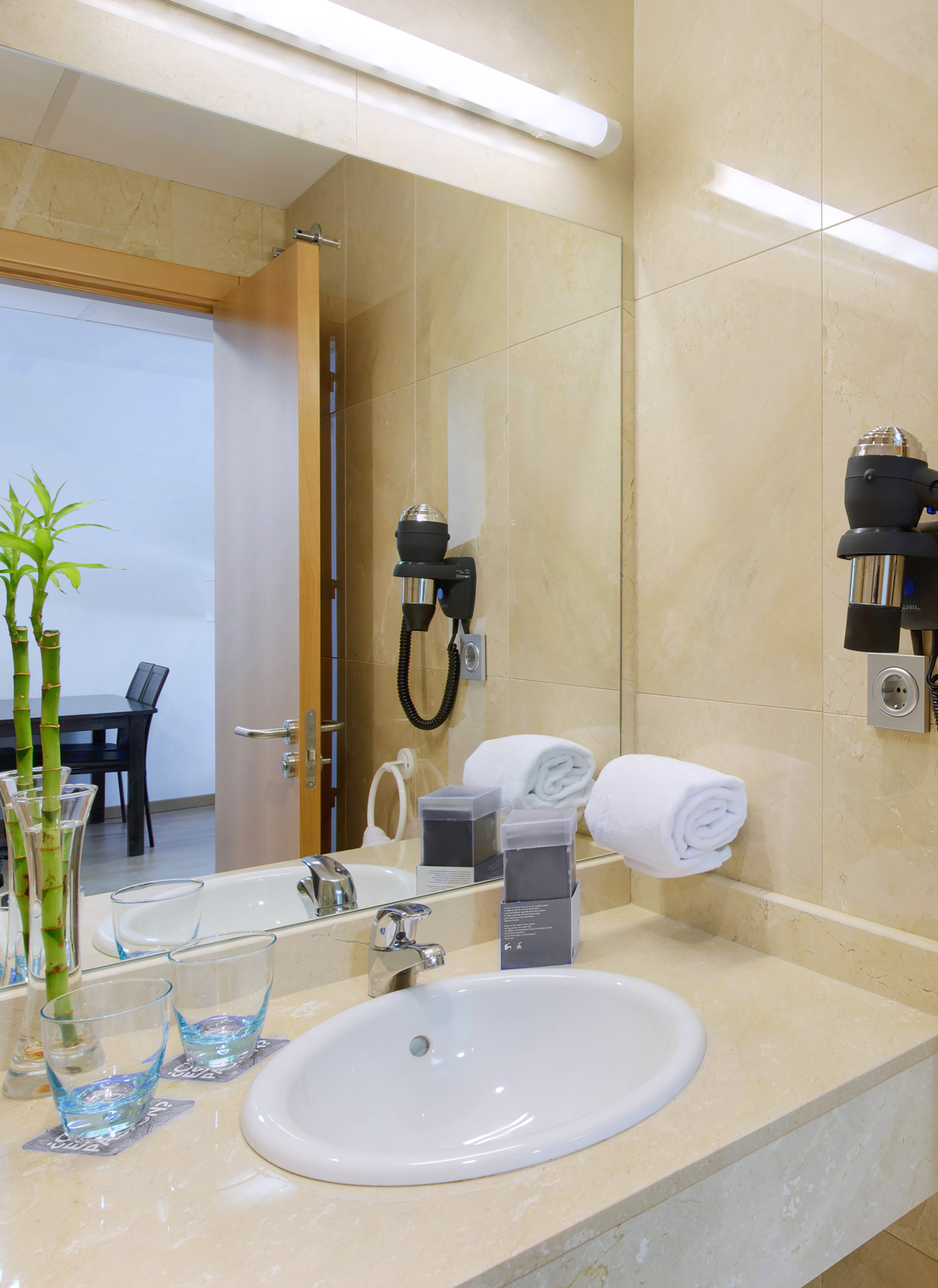 a bathroom with a mirror and sink