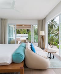 a bedroom with a bed and couch