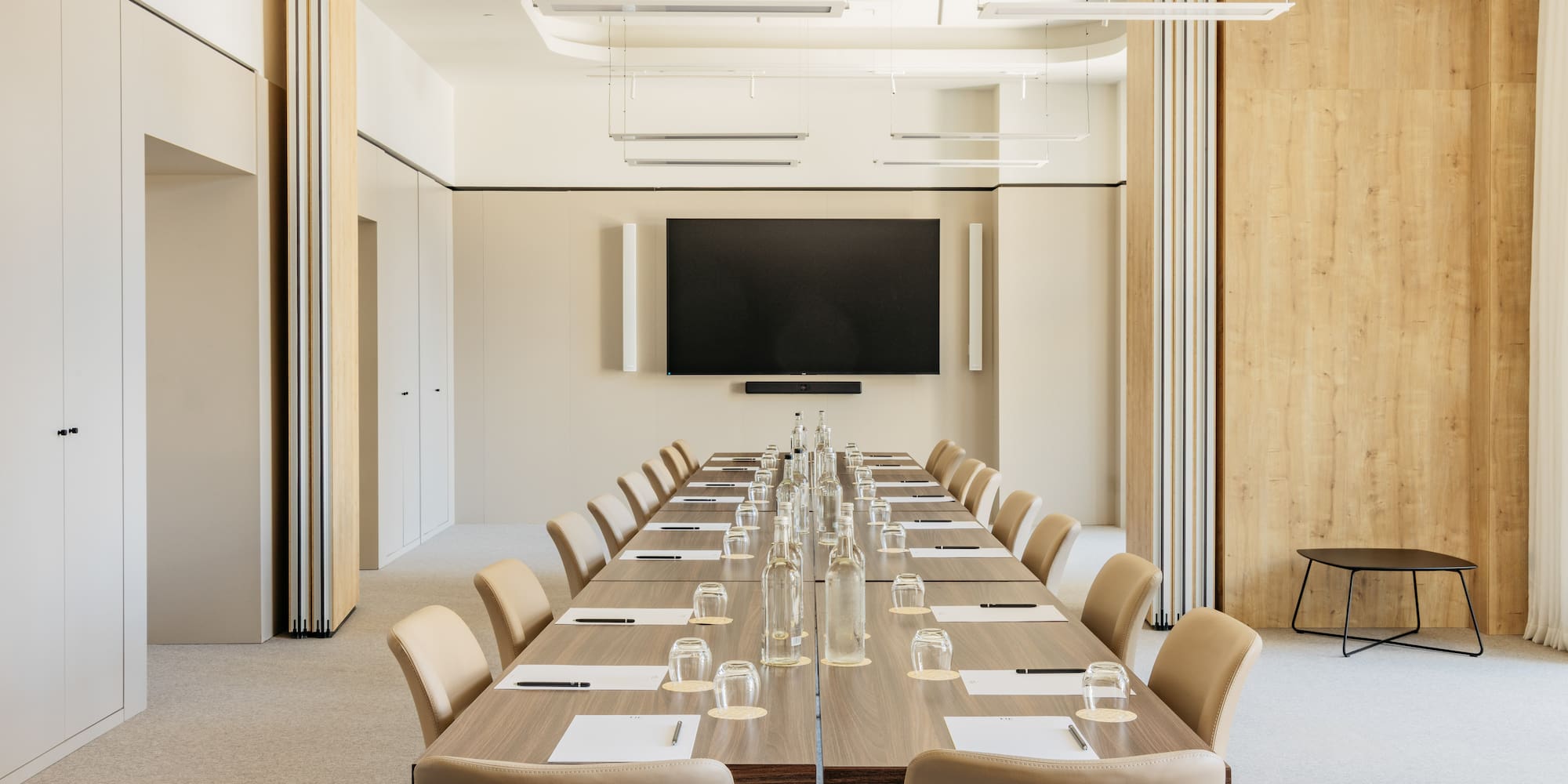 a conference room with a table and chairs