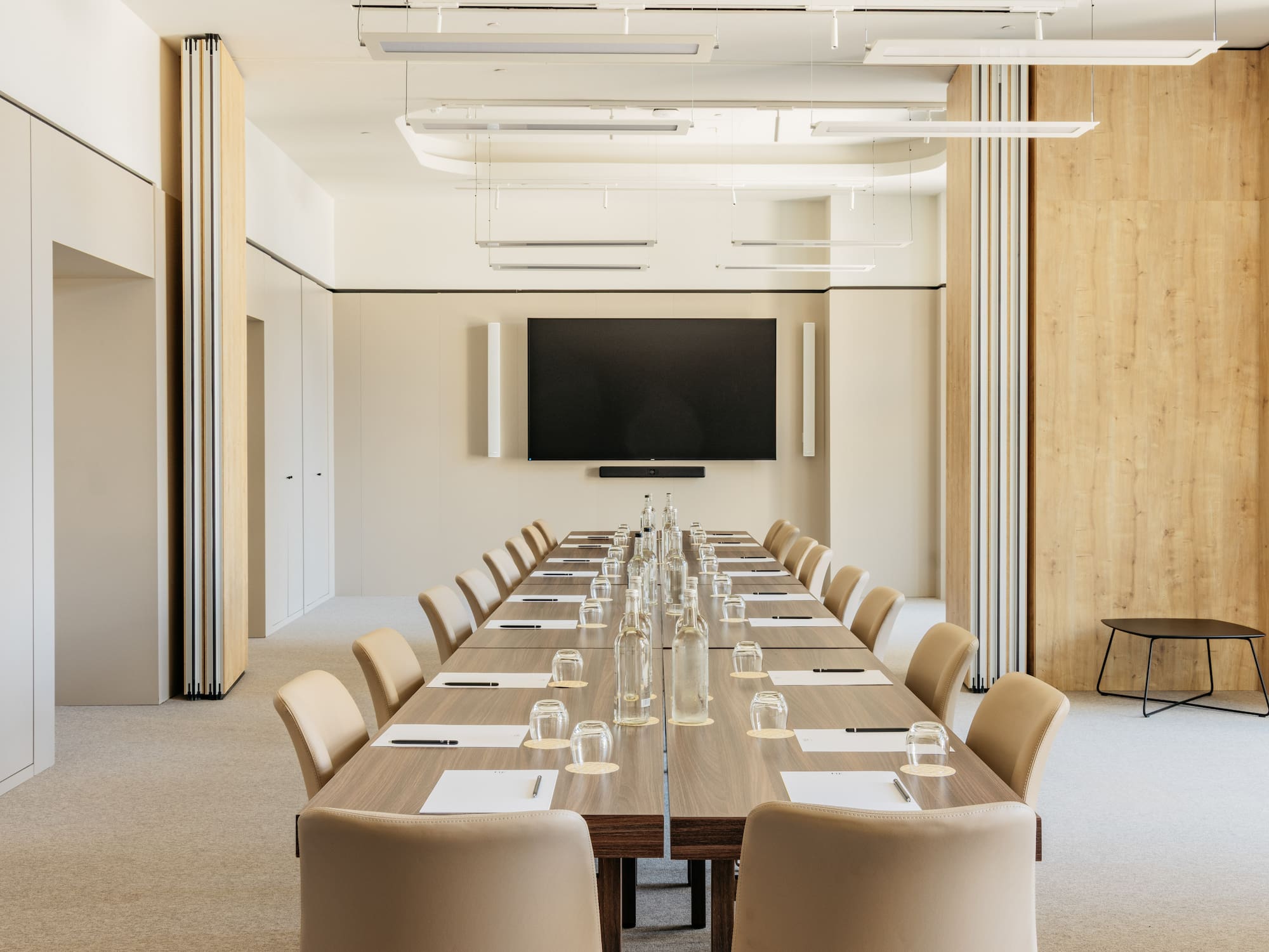 a conference room with a table and chairs