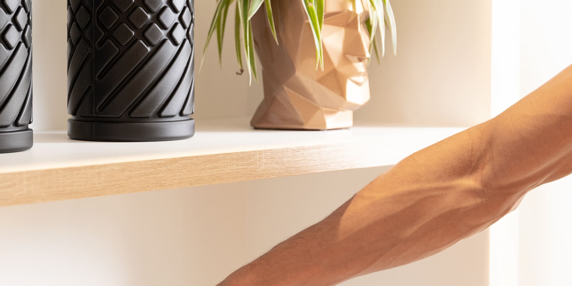 a person's hand on a metal bar