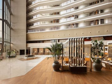 a large building with many balconies and plants