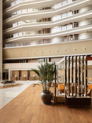 a large building with many balconies and plants