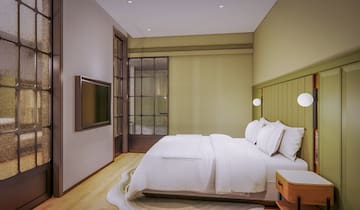 a bed with a tv in a room