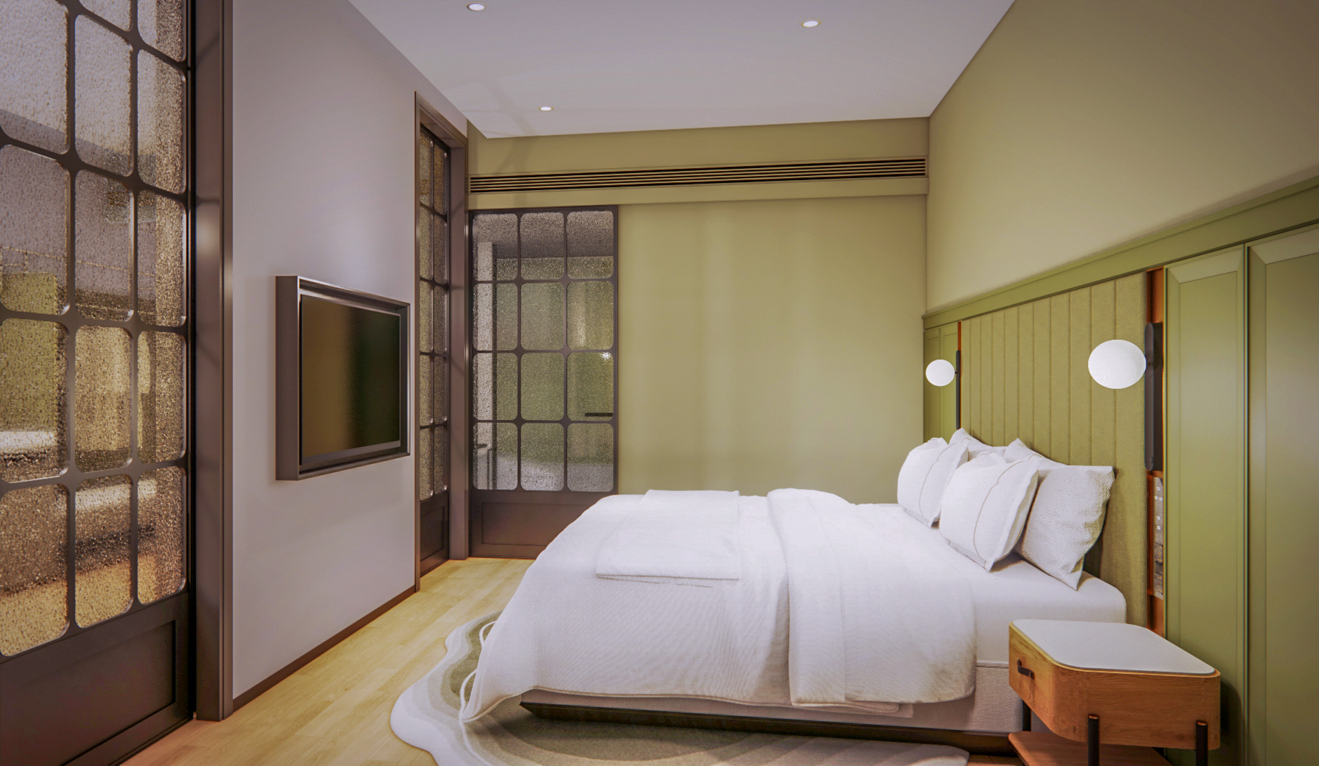 Modern hotel bedroom with white bed, green headboard, TV, and frosted glass doors.