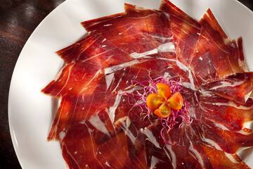 a plate of meat on a white plate