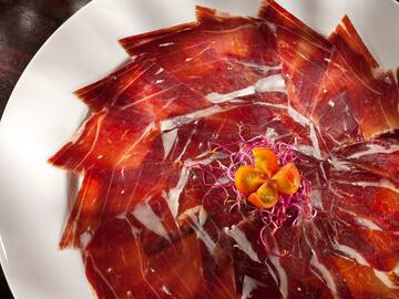 a plate of meat on a white plate