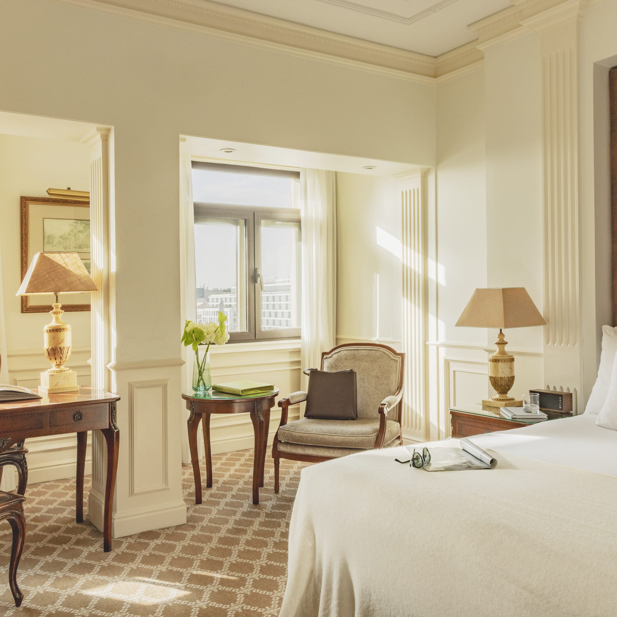 a bedroom with a bed and a desk and chair