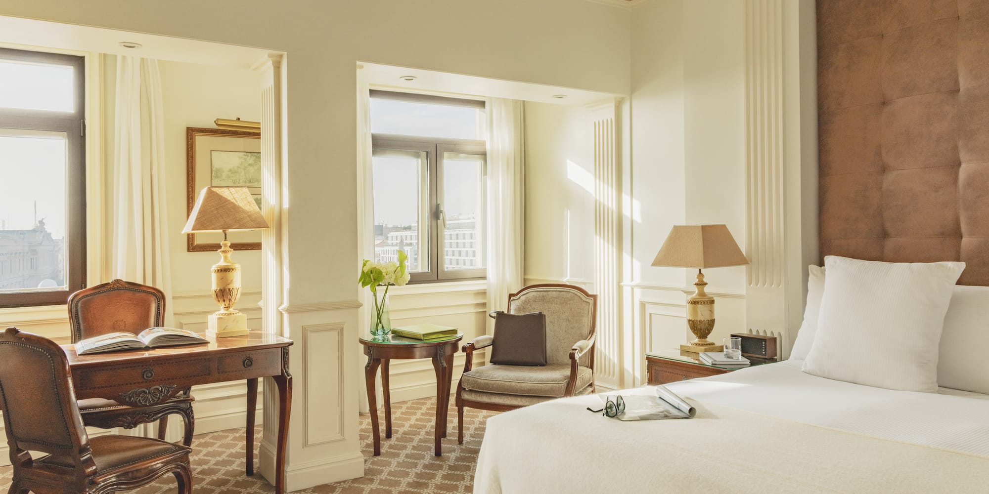 a bedroom with a bed and a desk and chair