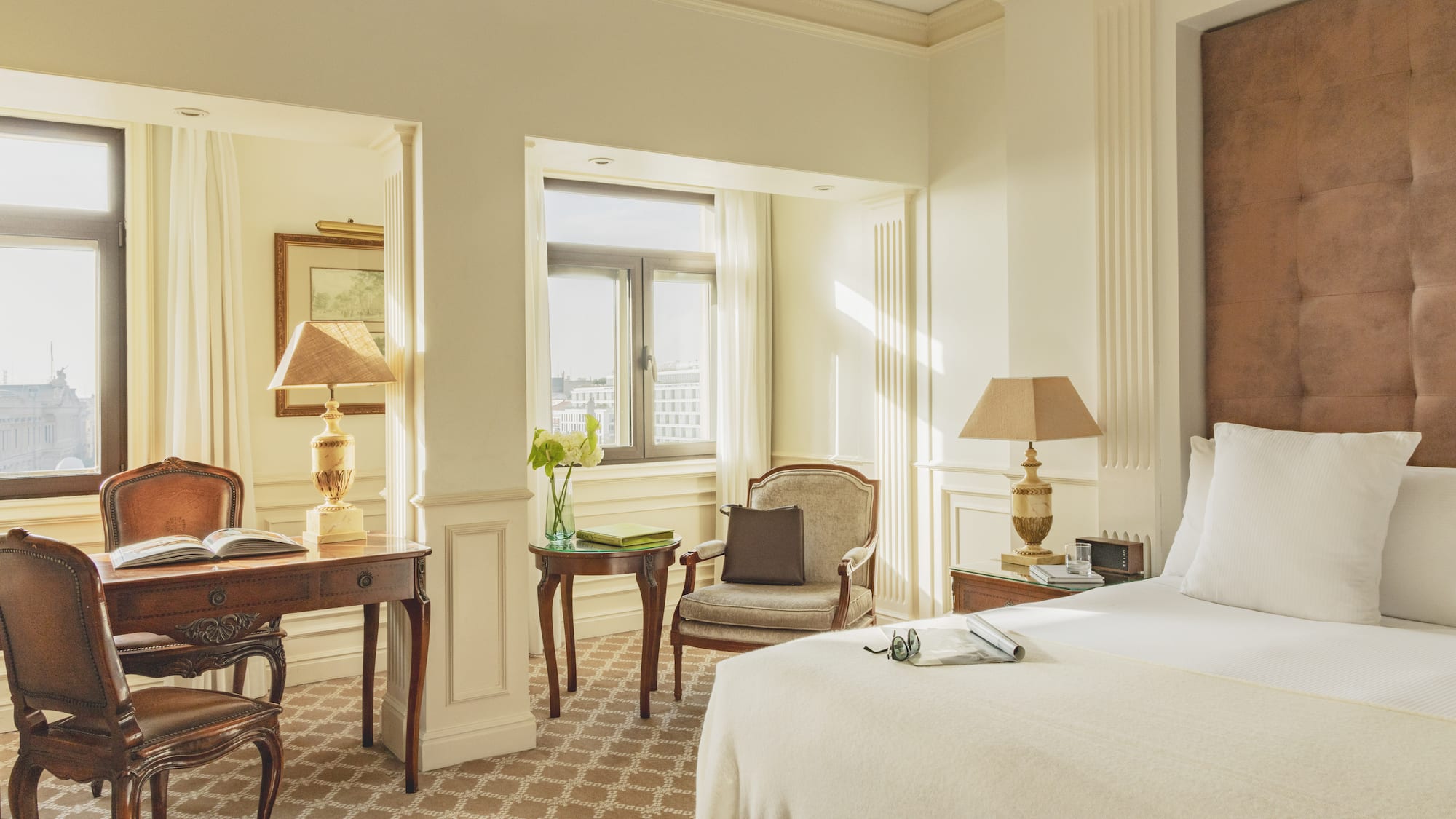 a bedroom with a bed and a desk and chair