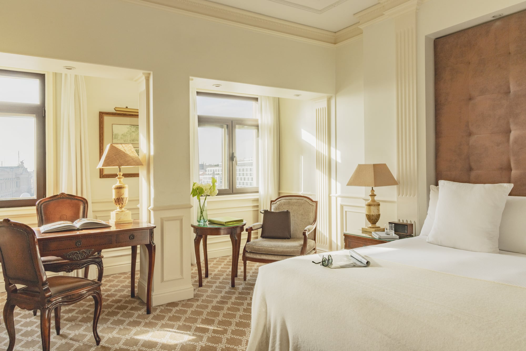 a bedroom with a bed and a desk and chair