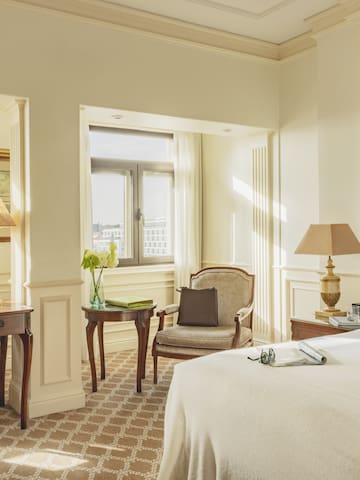 a bedroom with a bed and a desk and chair