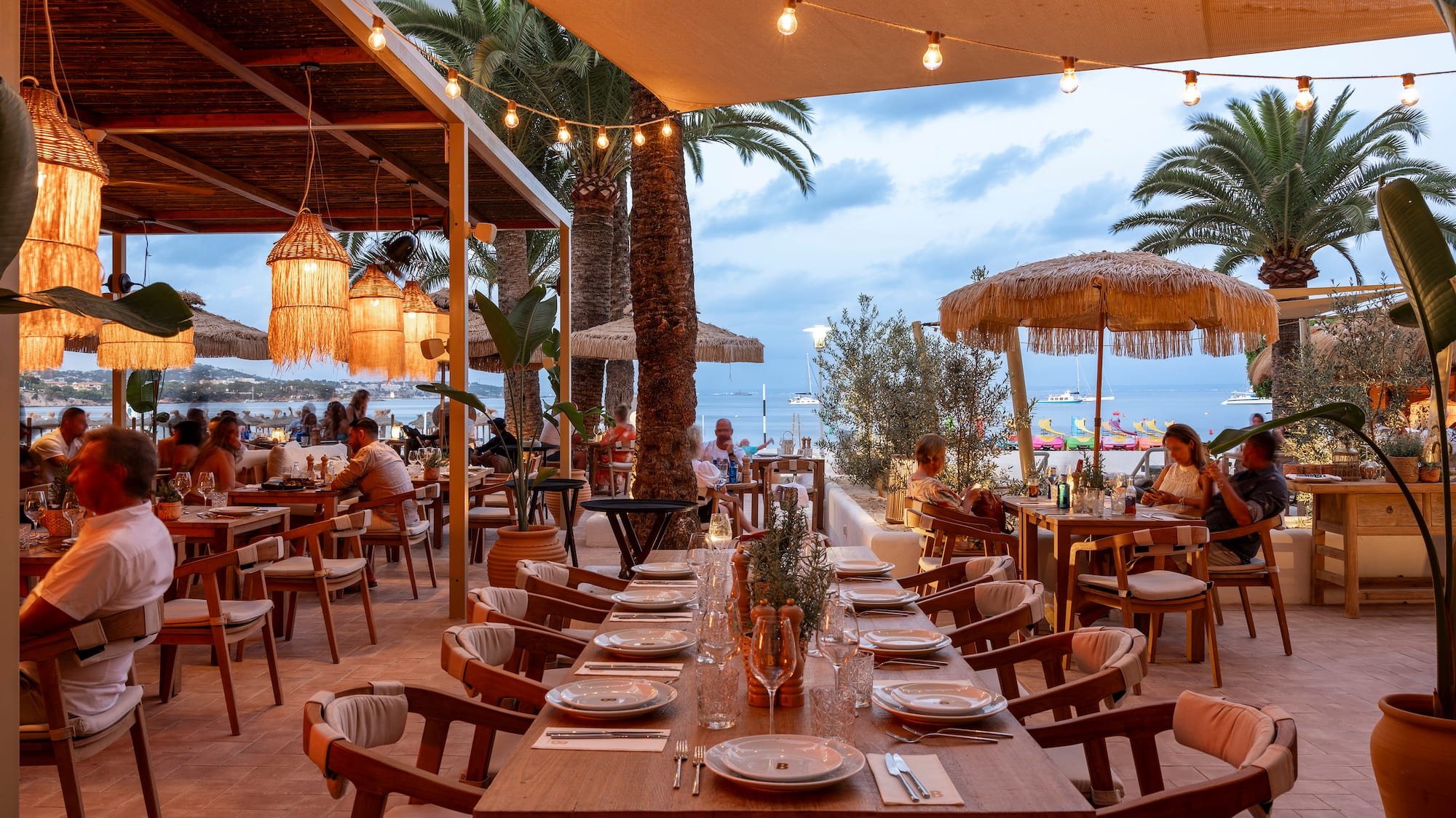 a restaurant with tables and chairs and umbrellas
