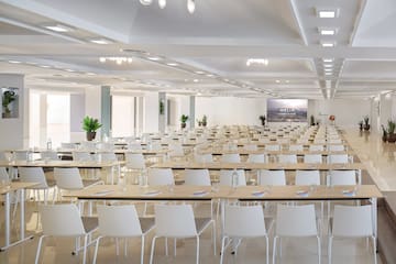 a large room with tables and chairs