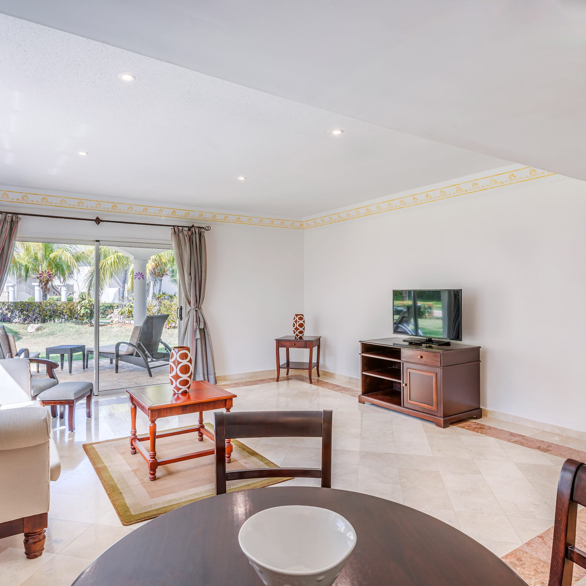 a living room with a television and a table