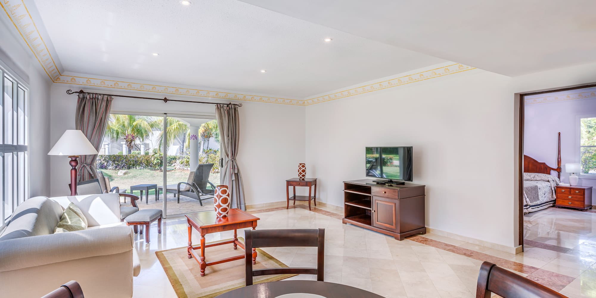 a living room with a television and a table