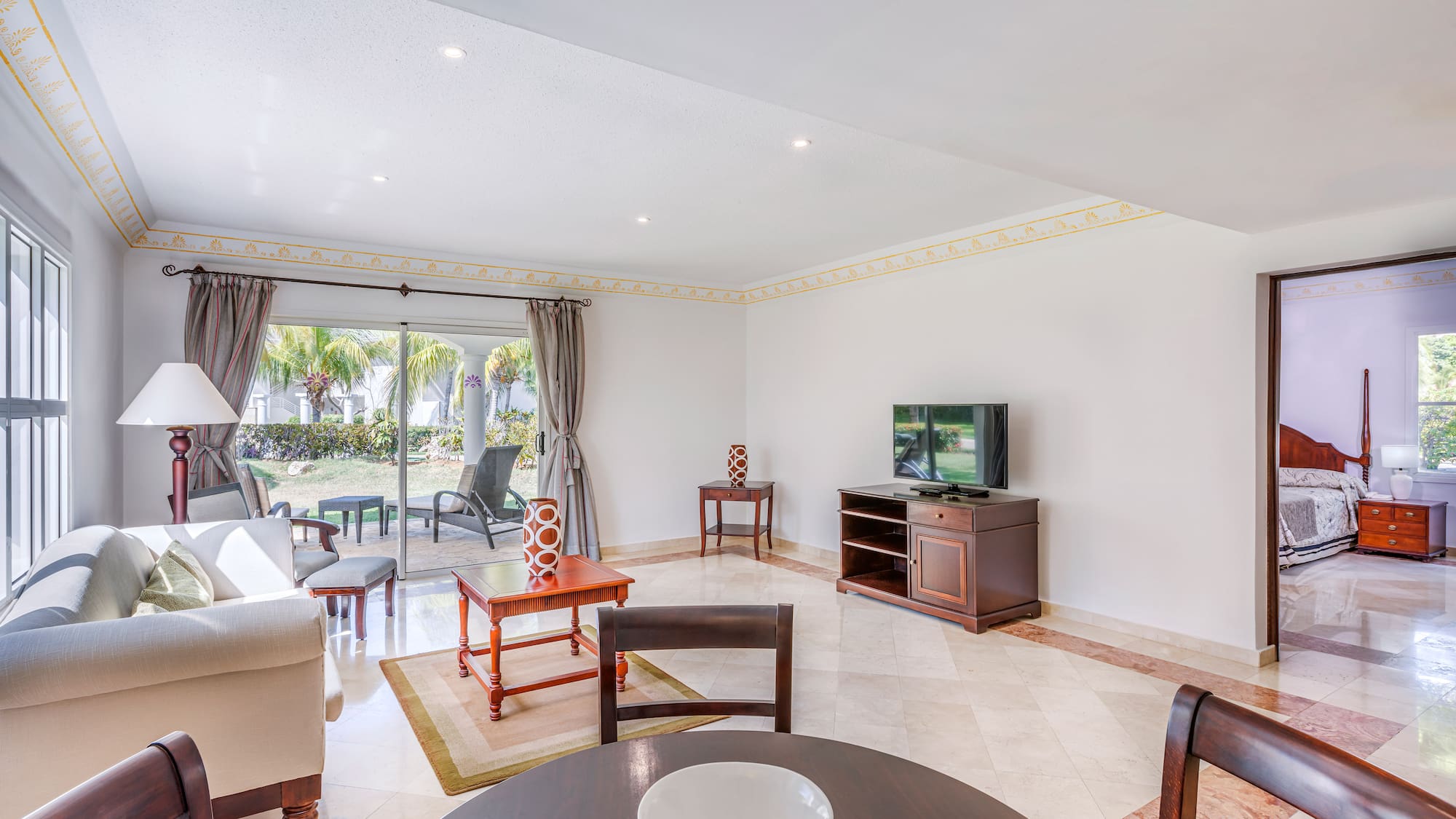 a living room with a television and a table