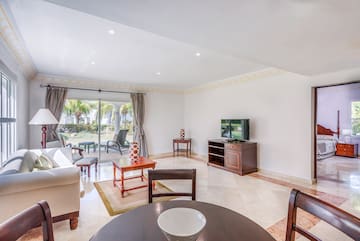 a living room with a television and a table