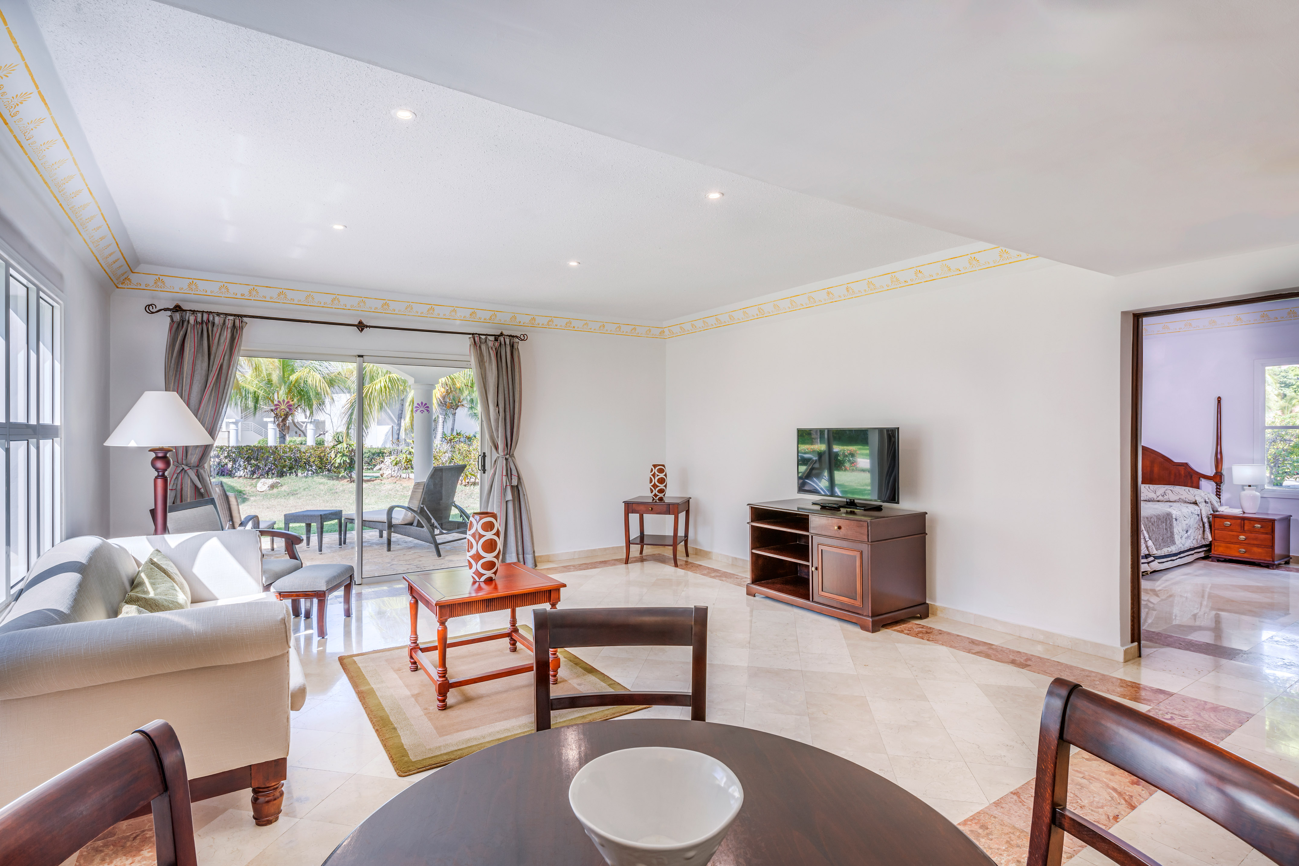 a living room with a television and a table