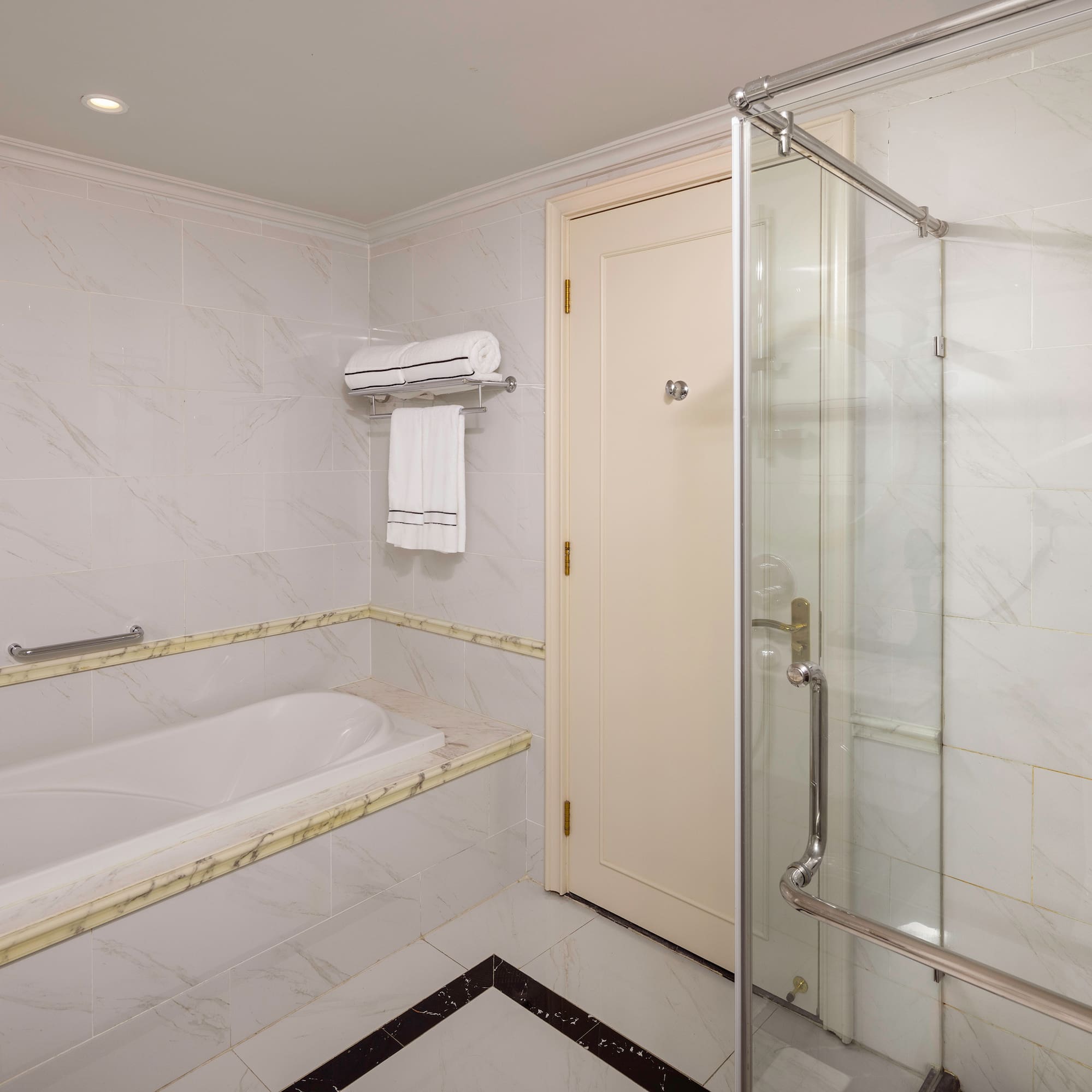 a bathroom with a bathtub and shower