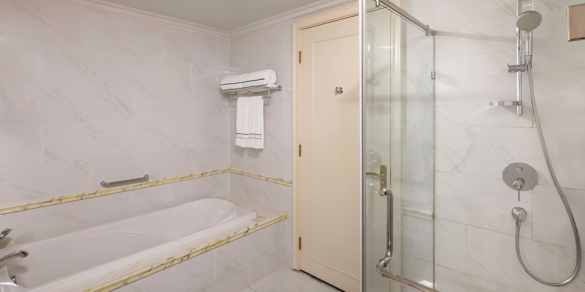 a bathroom with a bathtub and shower