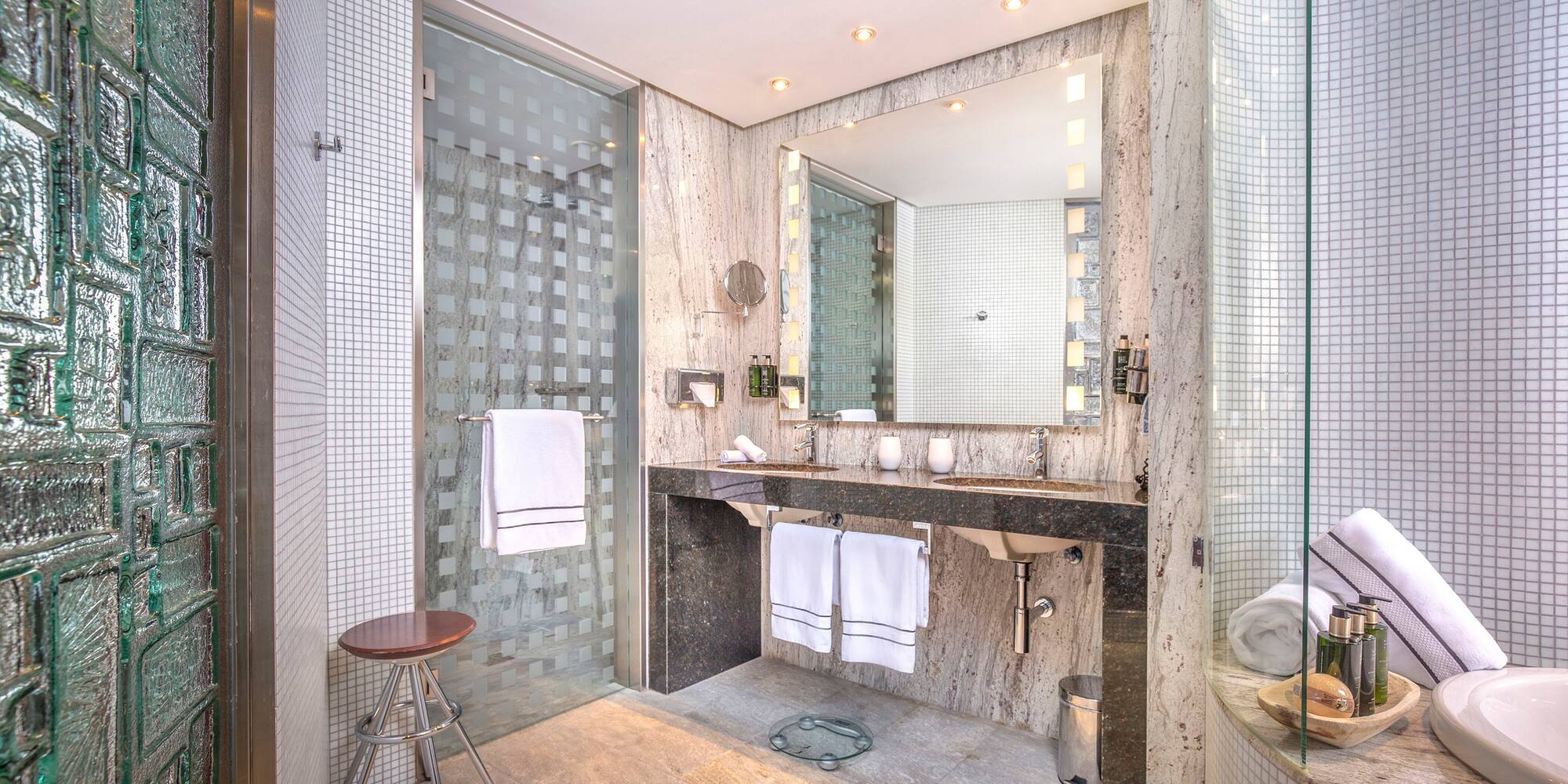 a bathroom with a mirror and sink