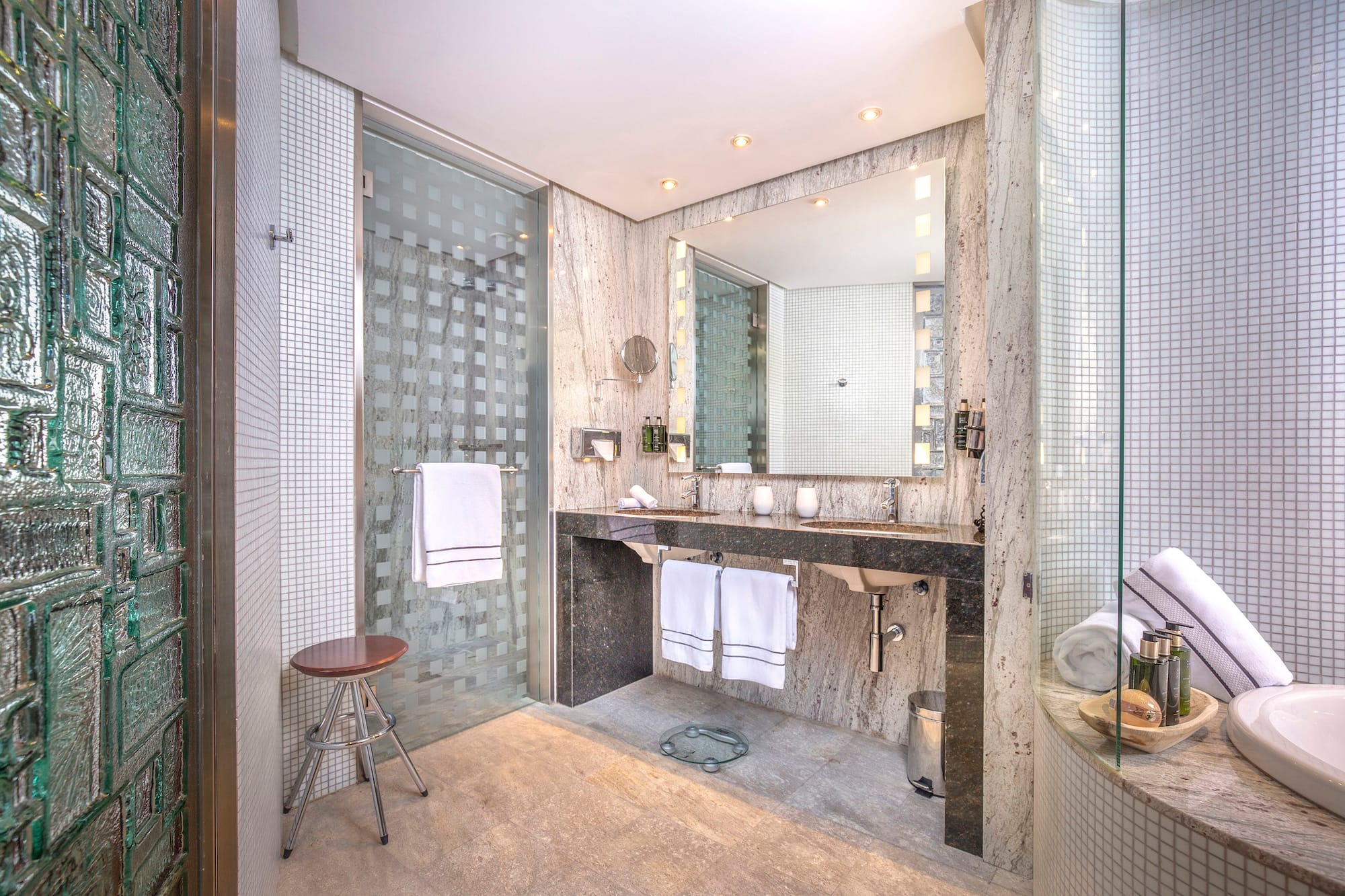 a bathroom with a mirror and sink