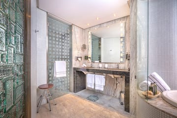 a bathroom with a mirror and sink