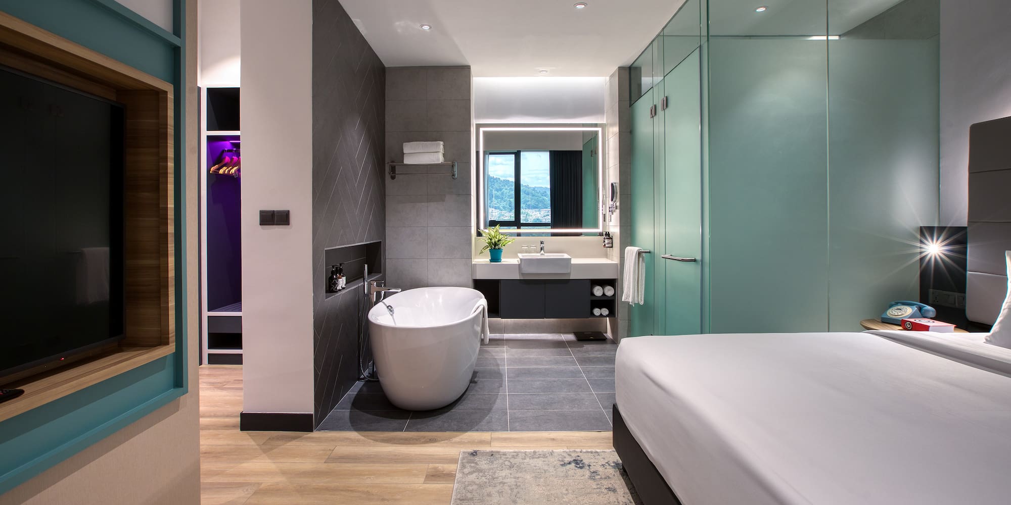 a room with a bed and bathtub